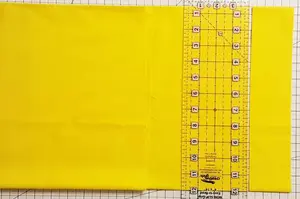 See how to cut strips with a rotary cutter accurately for quilting. Get those long strips of fabric ready for subcutting units to make quilt blocks!