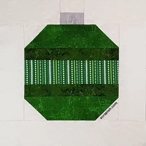 Use strip sets to make a Christmas ornament quilt block pattern. Quickly make enough 6 inch and 12 inch ornament blocks for a bed quilt...easy!