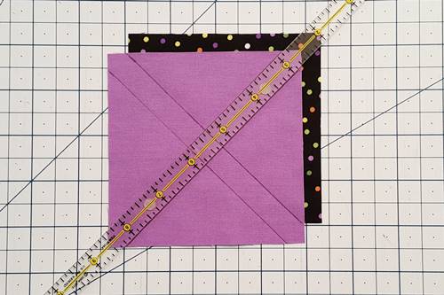Step 1a 3 patch quarter square triangles: Mark Top Square Place one Fabric A square right side up and place one Fabric B square right side down on top of it.
