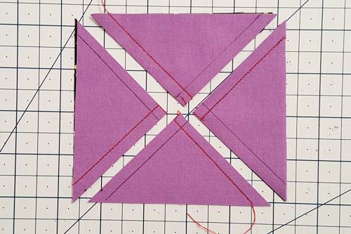 Step 3a 3 patch quarter square triangles:  Cut the square in half again by cutting it diagonally from the other corner to corner.