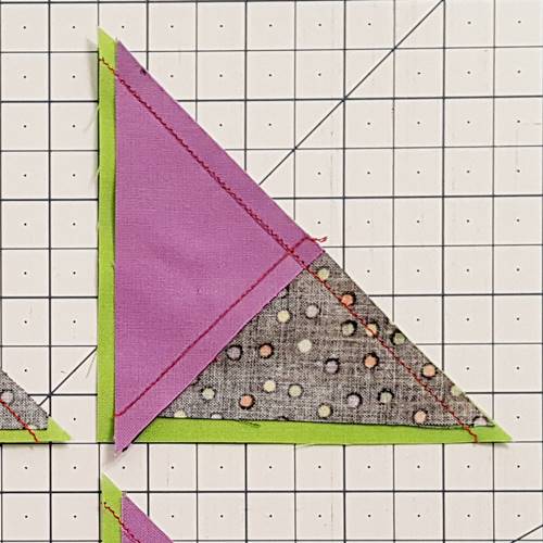 Step 4a 3 patch quarter square triangles:  With right sides together, pair one of the QST halves with one of the half square triangle halves.