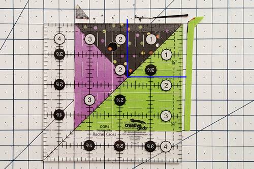Step 7 3 patch quarter square triangles: Use a rotary cutter to trim the unit along the right and top edges.