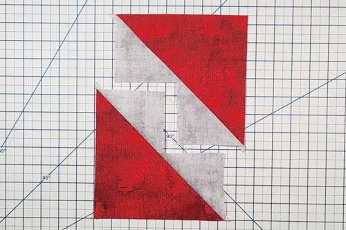 Step 5 No Waste Flying Geese: Flip the small triangles right side up and press the seams toward the small triangles. Step 5 No Waste Flying Geese: Flip the small triangles right side up and press the seams toward the small triangles.