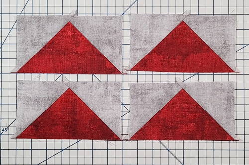 Step 8 4 Flying Geese At Once: Flip the small triangles right side up. Press the seams toward the small triangles. Step 8 4 Flying Geese At Once: Flip the small triangles right side up. Press the seams toward the small triangles.