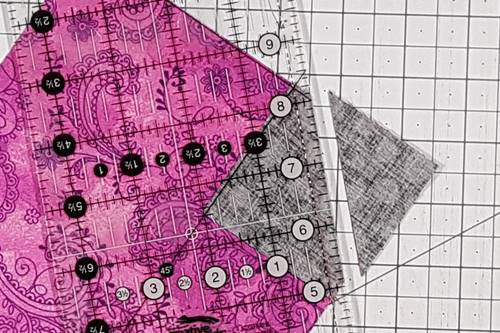 Step 4 Cat Quilt Block: Trim corner of each stitched on square 1/4 inch from the seam line. Step 4 Cat Quilt Block: Trim corner of each stitched on square 1/4 inch from the seam line.