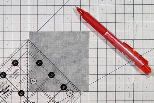 Cat Quilt Block II: Draw the diagonal lines on the squares that make up the ears  somewhere south of the 45 degree line. Cat Quilt Block II: Draw the diagonal lines on the squares that make up the ears  somewhere south of the 45 degree line.