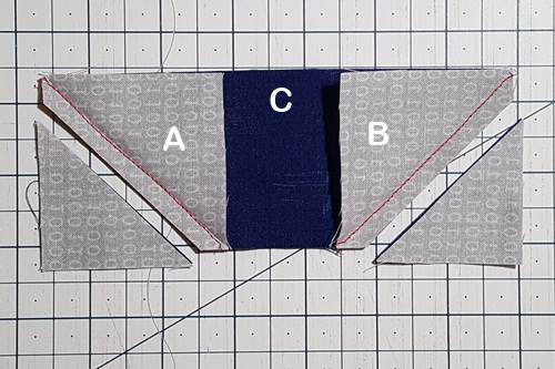 Step 3 Cat Quilt Block Pattern: Trim each corner to make the ears. Step 3 Cat Quilt Block Pattern: Trim each corner 1/4 inch from the seam line to make the ears.