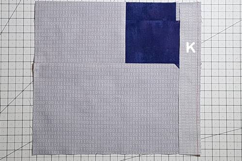 Step 10 Cat Quilt Block Pattern: Stitch Piece K to unit E/F/G/H/J. Step 10 Cat Quilt Block Pattern: Stitch Piece K to unit E/F/G/H/J. Press seam toward Piece K.