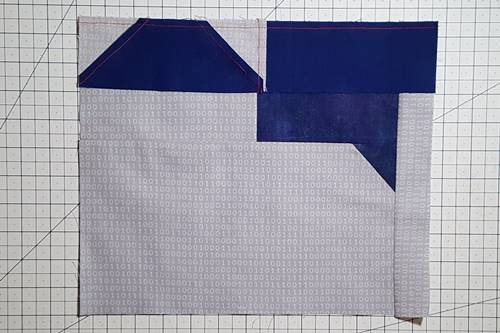 Step 12 Cat Quilt Block Pattern: Stitch the ear unit to the body unit. Step 12 Cat Quilt Block Pattern: Stitch the ear unit to the body unit. Press the seam up, toward the ear unit.