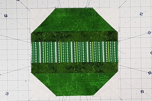 Step 4c Christmas Ornament Quilt Block Pattern: Press the seam each corner triangle towards the triangle.