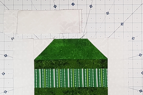 Step 6a Christmas Ornament Quilt Block Pattern: stitch left ornament cap section to side strip A1.