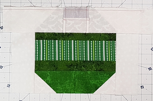 Step 8 Christmas Ornament Quilt Block Pattern: stitch the cap section to the main square section.