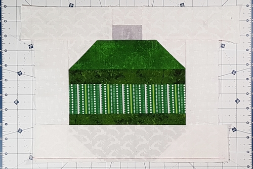 Step 9 Christmas Ornament Quilt Block Pattern: stitch Strip F to bottom of main ornament section. Press the seam toward Strip F.