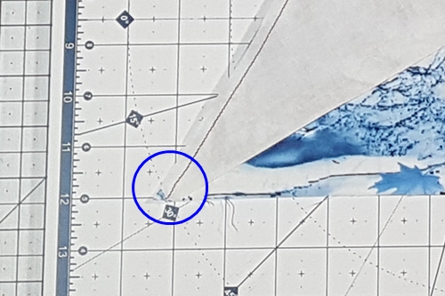 Step 5b Christmas Tree Quilt Block: match  bottom flat tip of the side triangle with the bottom edge of the main triangle Step 5b Christmas Tree Quilt Block: match  bottom flat tip of the side triangle with the bottom edge of the main triangle