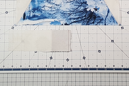 Step 9 Christmas Tree Quilt Block: stitch left background fabric to tree trunk. Step 9 Christmas Tree Quilt Block: stitch left background fabric to tree trunk.