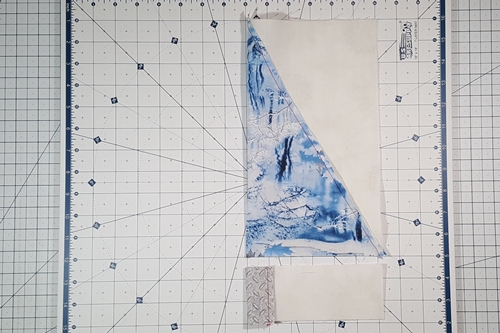 Step 10 Christmas Tree Quilt Block: Fold both sections in half vertically and finger press a crease in the center of each. Step 10 Christmas Tree Quilt Block: Fold both sections in half vertically and finger press a crease in the center of each.