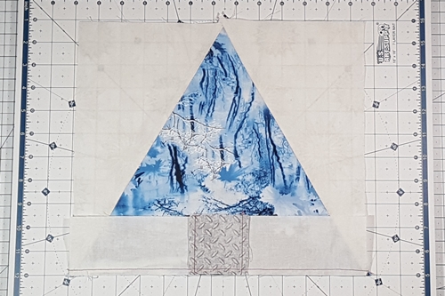 Step 11 Christmas Tree Quilt Block: With right sides together, match the creases on both sections. Stitch a 1/4 inch seam. Step 11 Christmas Tree Quilt Block: With right sides together, match the creases on both sections. Stitch a 1/4 inch seam.