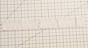 Step 2b churn dash quilt block pattern: cut bar units to width needed.