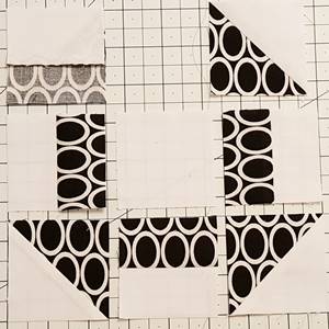 Step 5a churn dash quilt block pattern: Stitch the Rows.