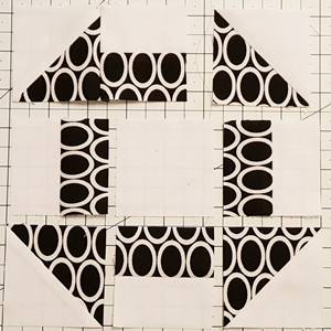 Step 5b churn dash quilt block pattern: Sew the units together using a 1/4 inch seam along the right side of the block units.