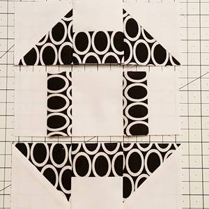 Step 6b churn dash quilt block pattern: sew the units of Row 2 together. Finger press the seams towards the bar units, away from the center. Step 6c stitch and press toward center.