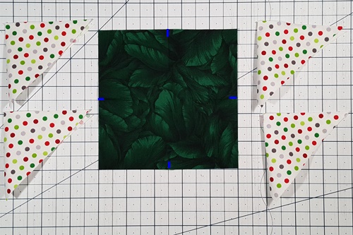 Step 3 Corner Triangles for Setting Blocks on Point: On all 4 sides find the center of the block to be set on point and mark. Step 3 Corner Triangles for Setting Blocks on Point: On all 4 sides find the center of the block to be set on point and mark.