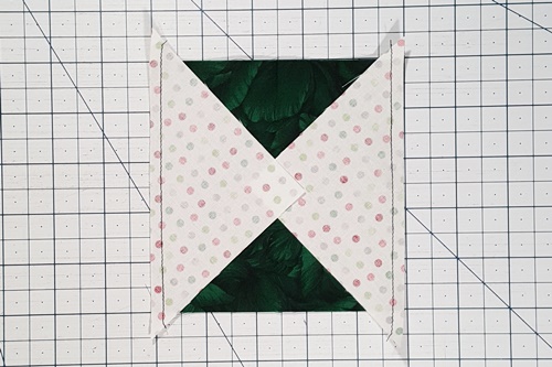 Step 4a Square in a Square: Stitch on the drawn line on the small squares. Step 4 Corner Triangles for Setting Blocks on Point: Right sides together, place one triangle on two opposite sides of square (or block). Stitch a 1/4 inch seam. Press the seams toward the triangles.
