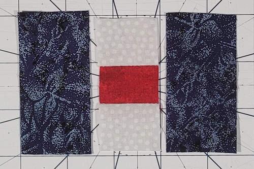 Courthouse Steps Quilt Block Pattern Step 6: Cut the left and right 'log' of round one about 1 1/2 inches wide and slightly longer than the previous unit made of center and top and bottom 'logs'. Courthouse Steps Quilt Block Pattern Step 6: Cut the left and right 'log' of round one about 1 1/2 inches wide and slightly longer than the previous unit made of center and top and bottom 'logs'.