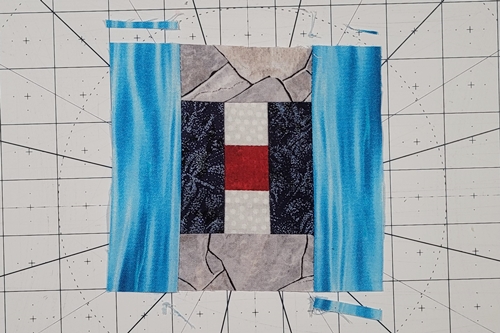 Courthouse Steps Quilt Block Pattern Step 12: Stitch a strip ('log') to the left side and right sides of the previous unit. Trim the side 'logs' even with the top and bottom. This completes Round 2. Courthouse Steps Quilt Block Pattern Step 12: Stitch a strip ('log') to the left side and right sides of the previous unit. Trim the side 'logs' even with the top and bottom. This completes Round 2.