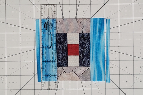 Courthouse Steps Quilt Block Pattern Step 14: Measure 1 inch away from each vertical seam and trim both side 'logs' to 1 inch wide. Courthouse Steps Quilt Block Pattern Step 14: Measure 1 inch away from each vertical seam and trim both side 'logs' to 1 inch wide.