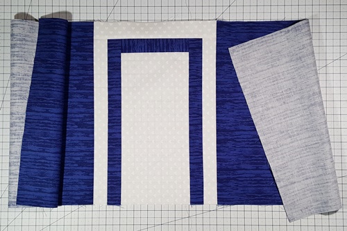 Step 6d Cross Quilt Pattern: Stitch Row 2 Left and Right panels (13 1/2 inch) to the left and right sides of Top Arm/Strip Set/Endcaps unit. The Top Arm section (Row 2) is now complete.