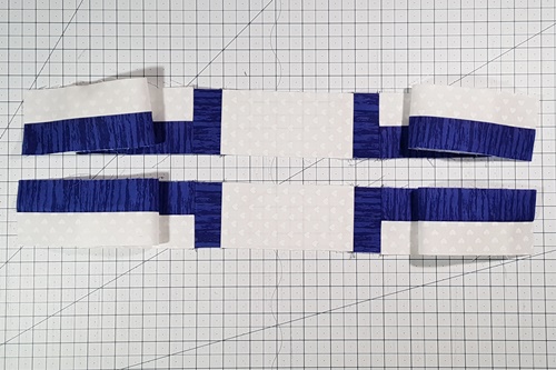 Step 7c Cross Quilt Pattern: Stitch one Crossbeam Strip Set, short end to short end, to each of the two Endcap B/Bridge/Endcap B units. Press seams away from Endcaps B.
