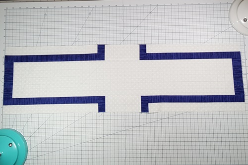 Step 7d Cross Quilt Pattern: With Fabric B at the bottom, stitch one bridge/Strip Set unit to top of Crossbeam. With Fabric B at the top, stitch one Bridge/Strip Set unit to bottom of Crossbeam unit.