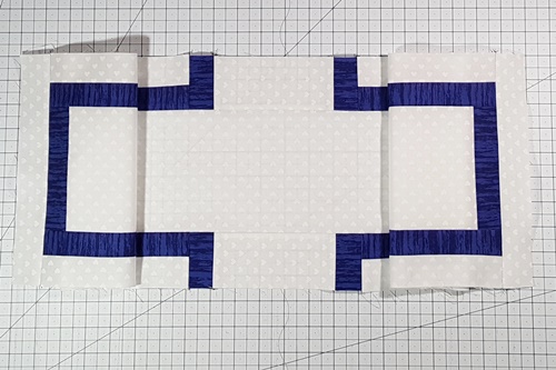 Step 7e Cross Quilt Pattern: Stitch one Endcap C to each short end of assembled crossbeam. Press seams toward Endcaps C.
The entire crossbeam section (Row 3) is now complete.