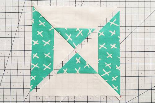 Step 7 Double Hourglass Quilt Block: Press the seams of each half in opposite directions.