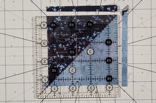 Duck Tracks Quilt Block Tutorial Step 5: Trim each HST to size.