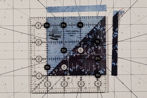Double Friendship Star Quilt Block Tutorial Step 5b: place both Fabric A HST squares on top of one another cut them in half along the left leaning (\) diagonal axis.