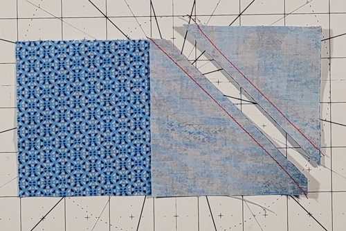 Duck Tracks Quilt Block Tutorial Step 7:
Stitch a seam along each diagonal edge. You get a bonus half square triangle which you can save for another project.