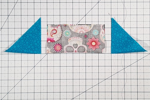 Step 4 Economy Quilt Block: Find the center of the center square and two triangles used for the inner corner triangles. Step 4 Economy Quilt Block: Find the center of the center square and two triangles used for the inner corner triangles.