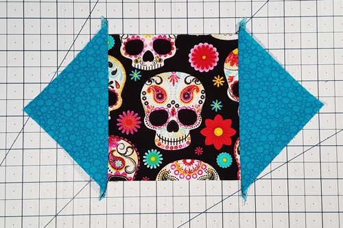 Step 6 Economy Quilt Block: Stitch a 1/4 inch seam and press the seams towards the triangles. Step 6 Economy Quilt Block: Stitch a 1/4 inch seam and press the seams towards the triangles.