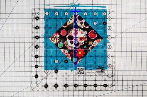 Step 8 Economy Quilt Block: Trim the inner corner triangles square to include a 1/4 inch seam allowance. Step 8 Economy Quilt Block: Trim the inner corner triangles square to include a 1/4 inch seam allowance.