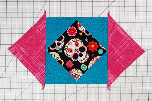 Step 9 Economy Quilt Block: Place square in a square unit with center square on point. Repeat Steps 4 to 6 to attach a corner triangle to each vertical side of the square in a square unit. Step 9 Economy Quilt Block: Place square in a square unit with center square on point. Repeat Steps 4 to 6 to attach a corner triangle to each vertical side of the square in a square unit.