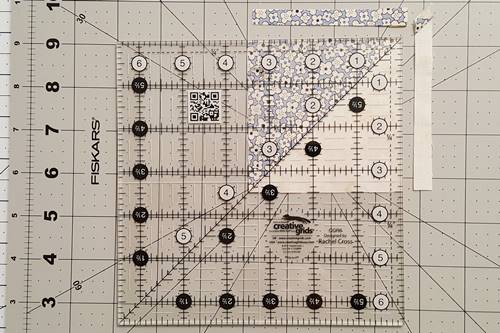 Step 5 Eight Point Star Quilt Block: Trim the half square triangles to 3 1/2 inches square.
