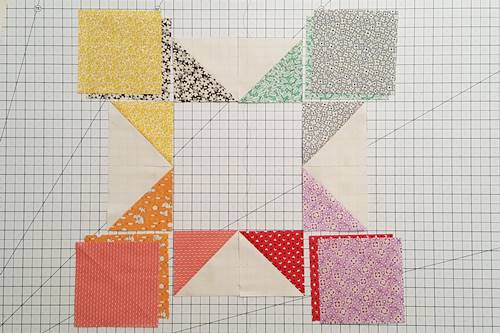 Step 6 Eight Point Star Quilt Block: Arrange one half square triangle of each color into star points.