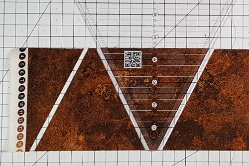 Step 2a Eight Pointed Star Quilt Block Pattern: From Fabric B strip cut 4 center triangles using the Tri Triangle Ruler.