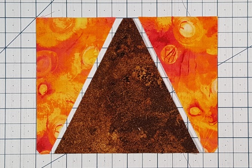 Step 3 Eight Pointed Star Quilt Block Pattern: Layout the triangle in a square pieces: left side triangle, center triangle, right side triangle.