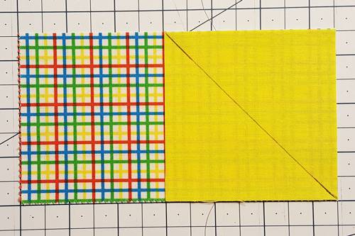 Step 2 Place the rectangle right side up. Place one square, right side down to begin making the flying geese.