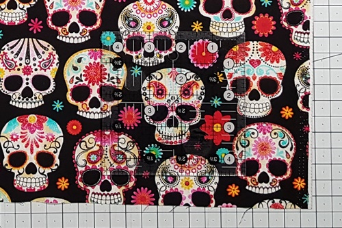 Step 1 Fussy Cut: Center a quilting ruler, about the size that you want the square to be, over a single layer of fabric in the area that you want to cut out. Step 1 Fussy Cut: Center a quilting ruler, about the size that you want the square to be, over a single layer of fabric in the area that you want to cut out.