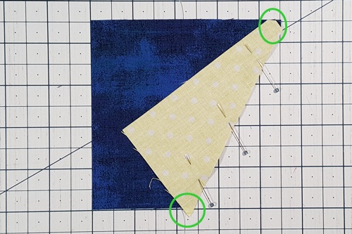 Step 2d Galaxy Star Quilt Block Variation Pattern: Align a side triangle to the remaining portion of the square, careful to align the slanted edge along the top right corner. Step 2d Galaxy Star Quilt Block Variation Pattern: Align a side triangle to the remaining portion of the square, careful to align the slanted edge along the top right corner.