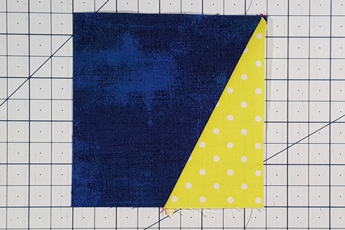 Step 2f Galaxy Star Quilt Block Variation Pattern: Press the side triangle right side up, pressing the seam towards it. Step 2f Galaxy Star Quilt Block Variation Pattern: Press the side triangle right side up, pressing the seam towards it.